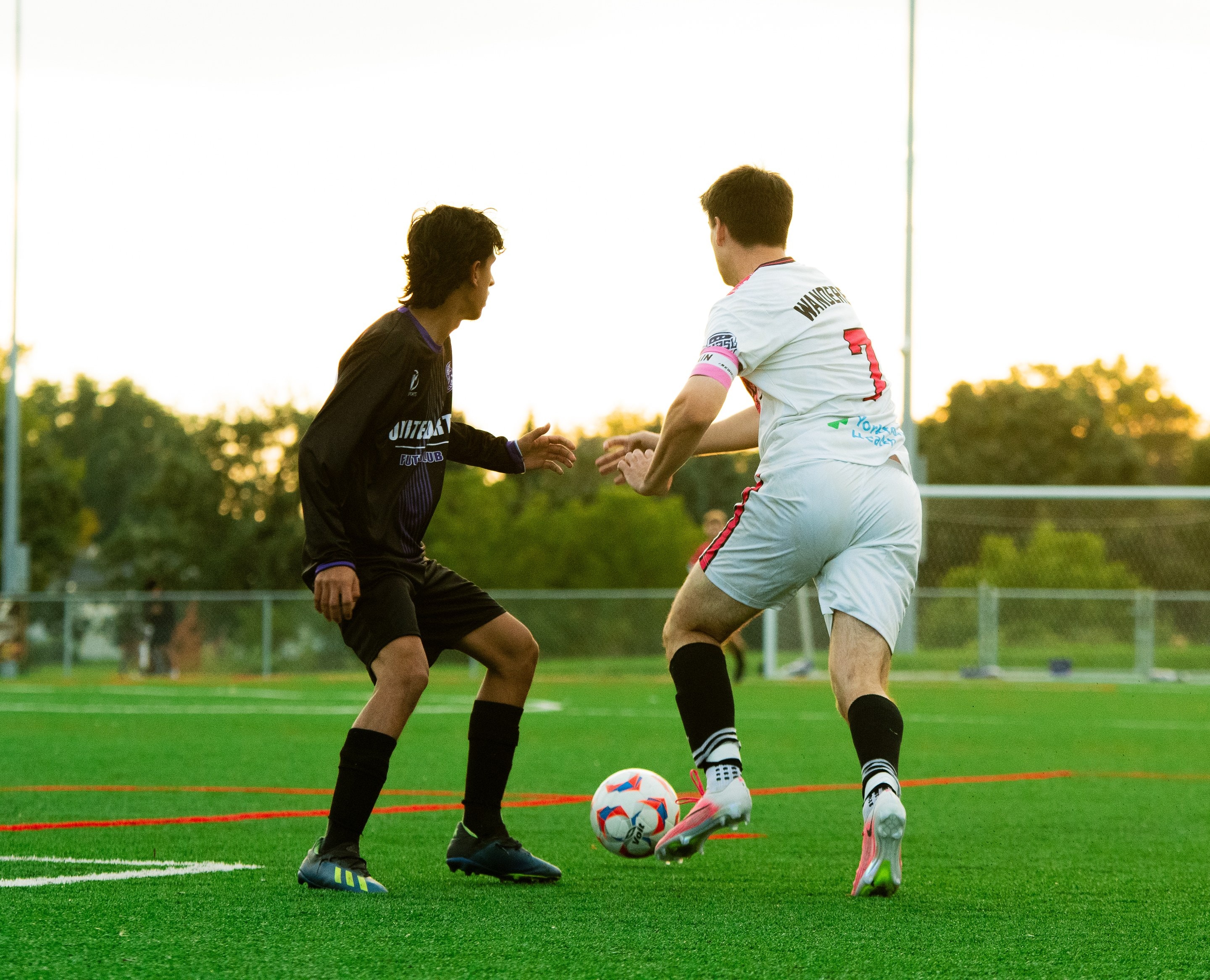 A Wanderers player beats a defender